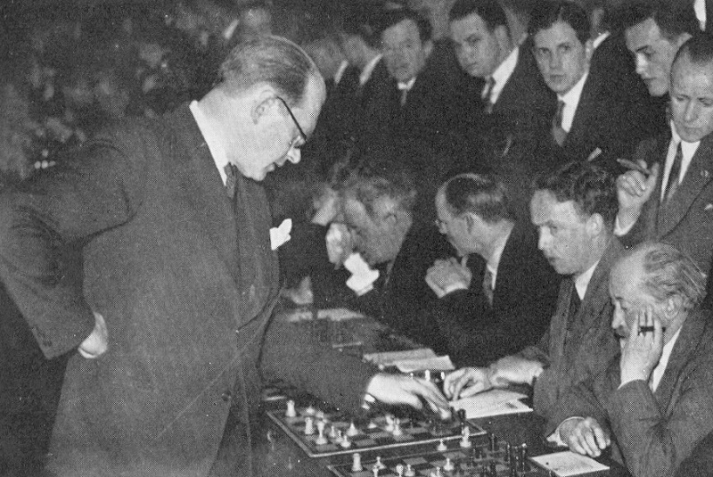 Capablanca seated far left, Marshall on the far right; unclear which  tournament, but at a guess somewhere between 1915 to 1920. #…